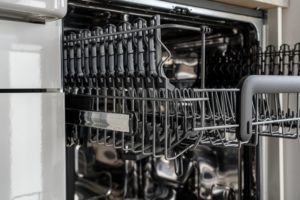 use brush to clean dishwasher