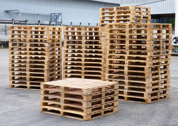 Stack of wooden pallets at warehouse